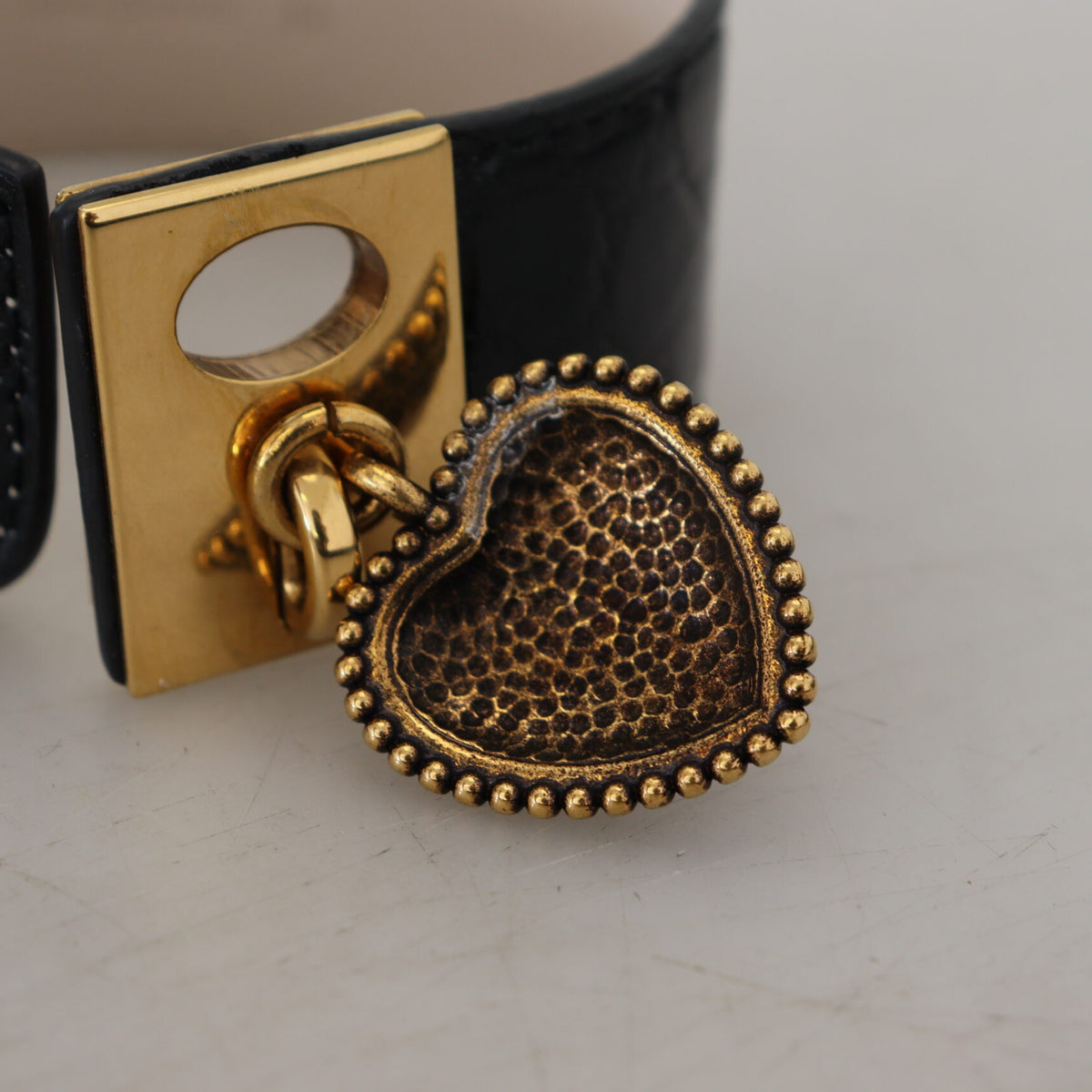 DOLCE &amp; GABBANA: Luxurious Black Leather Bracelet, Gold Clasp and Charms