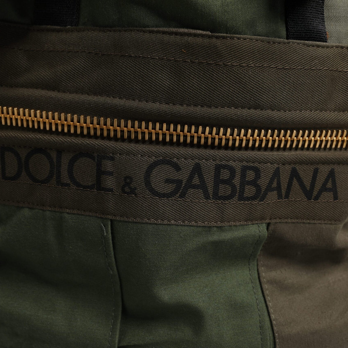 DOLCE &amp; GABBANA - Green military backpack: the luxury of haute couture for everyday wear.