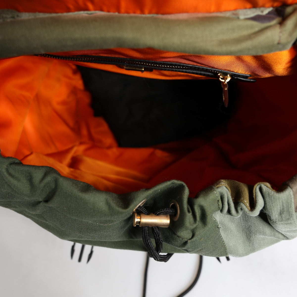 DOLCE &amp; GABBANA - Green military backpack: the luxury of haute couture for everyday wear.