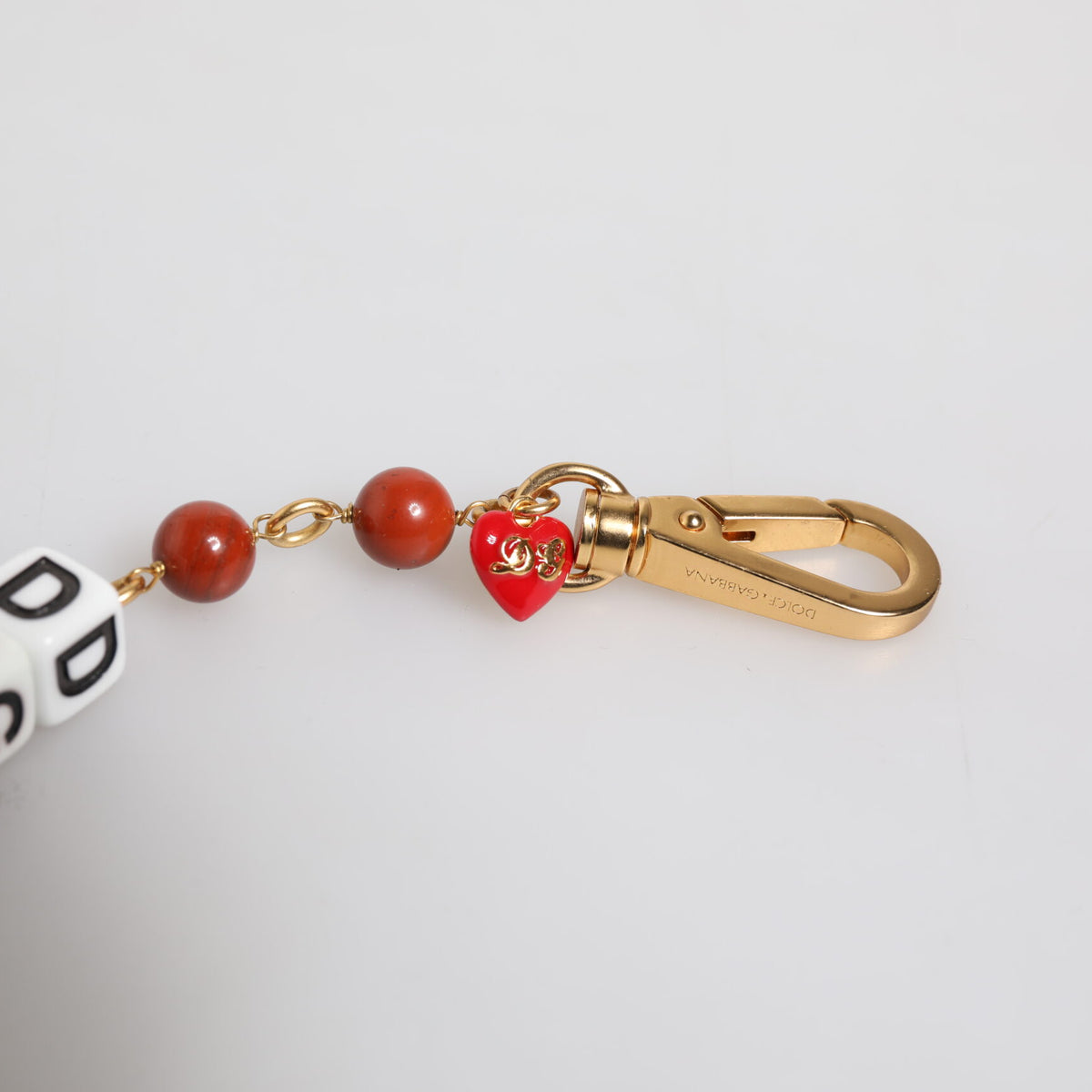 Bracelet Dolce & Gabbana "Chaîne Dorée : Dés DG, Perles & Cœur Rouge"